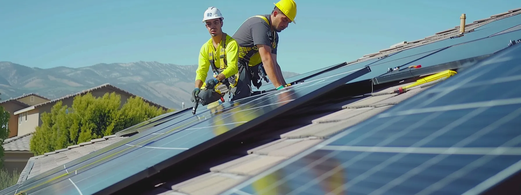workers installing solar panels on rooftops in north carolina and idaho.