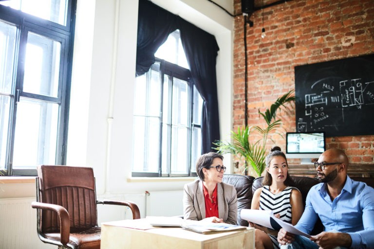 a group of people sitting at a table in a room