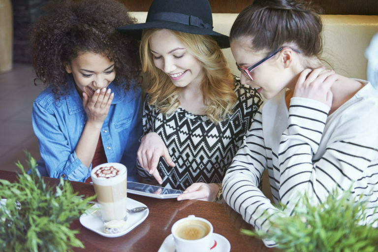 women looking over a tablet