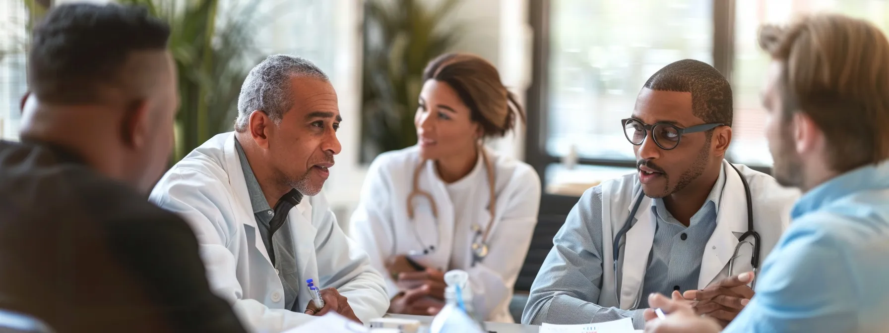 a group of professionals in a meeting, brainstorming ideas for improving patient experience in a dermatologist brick partnership.