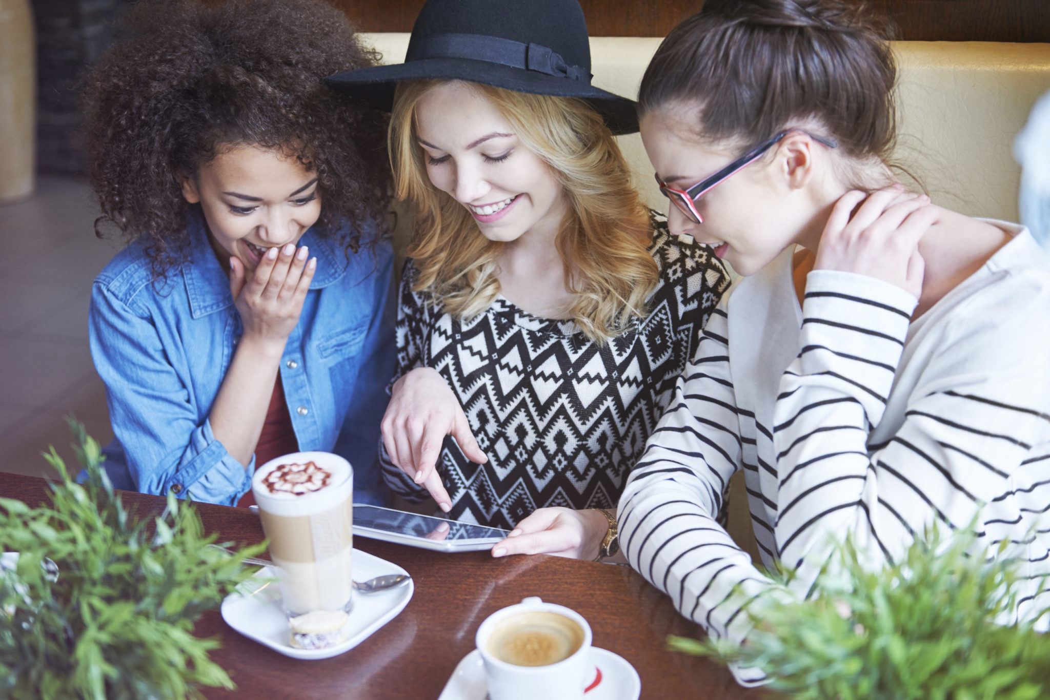 women looking over a tablet